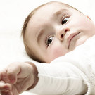 Color portrait of a boy at the age of 6 months.